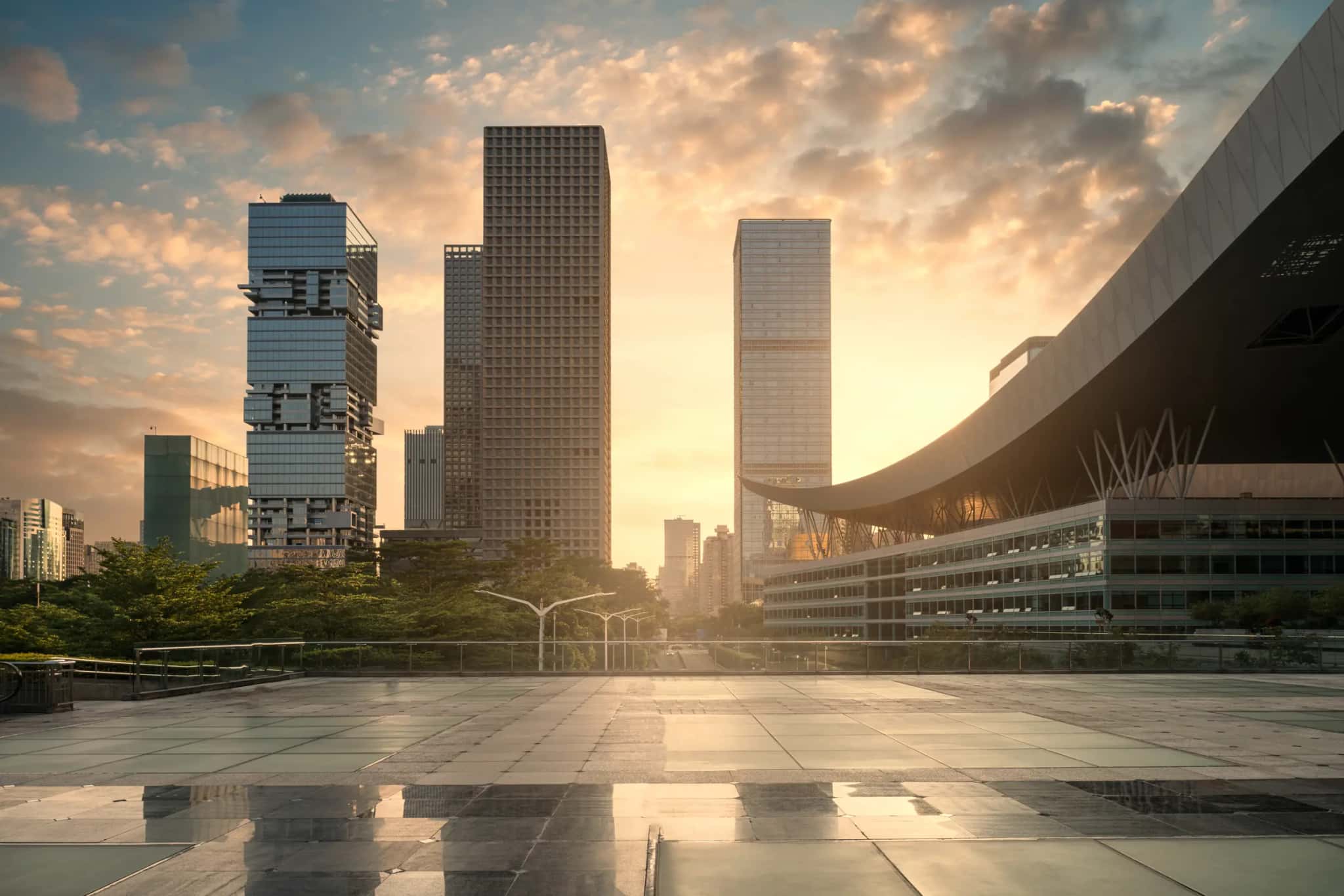 Corporate towers at sunset, seen from a plaza